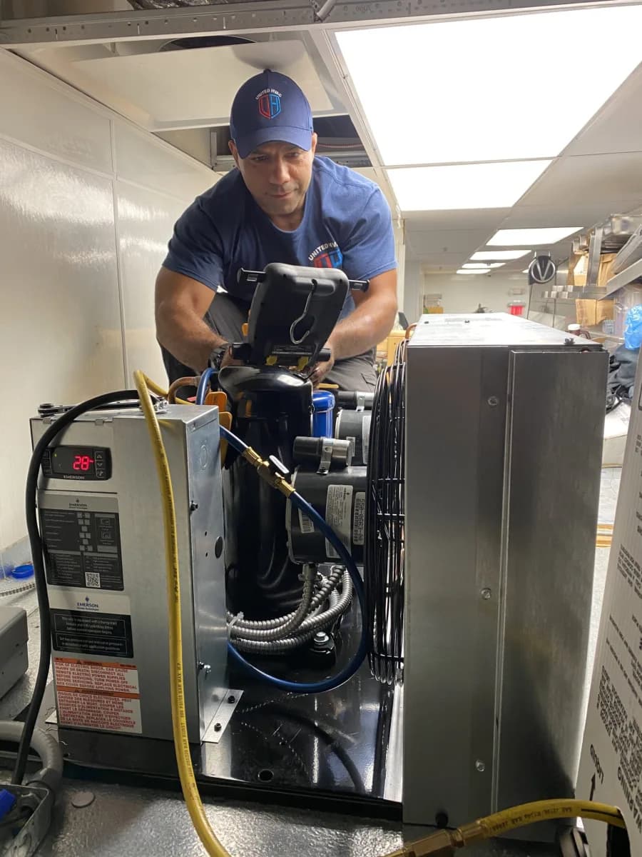 United HVAC owner Mahmoud Rashid servicing an HVAC system